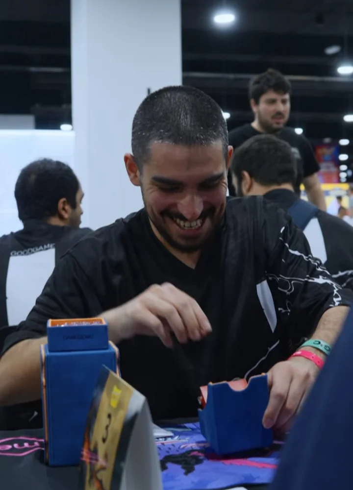 A player laughing across the table at tabletop.me